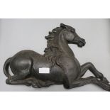 A cast iron horse doorstop