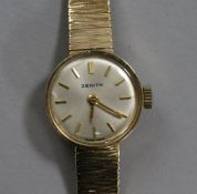 A lady's 9ct. gold Zenith manual wind wrist watch on 9ct gold bracelet.