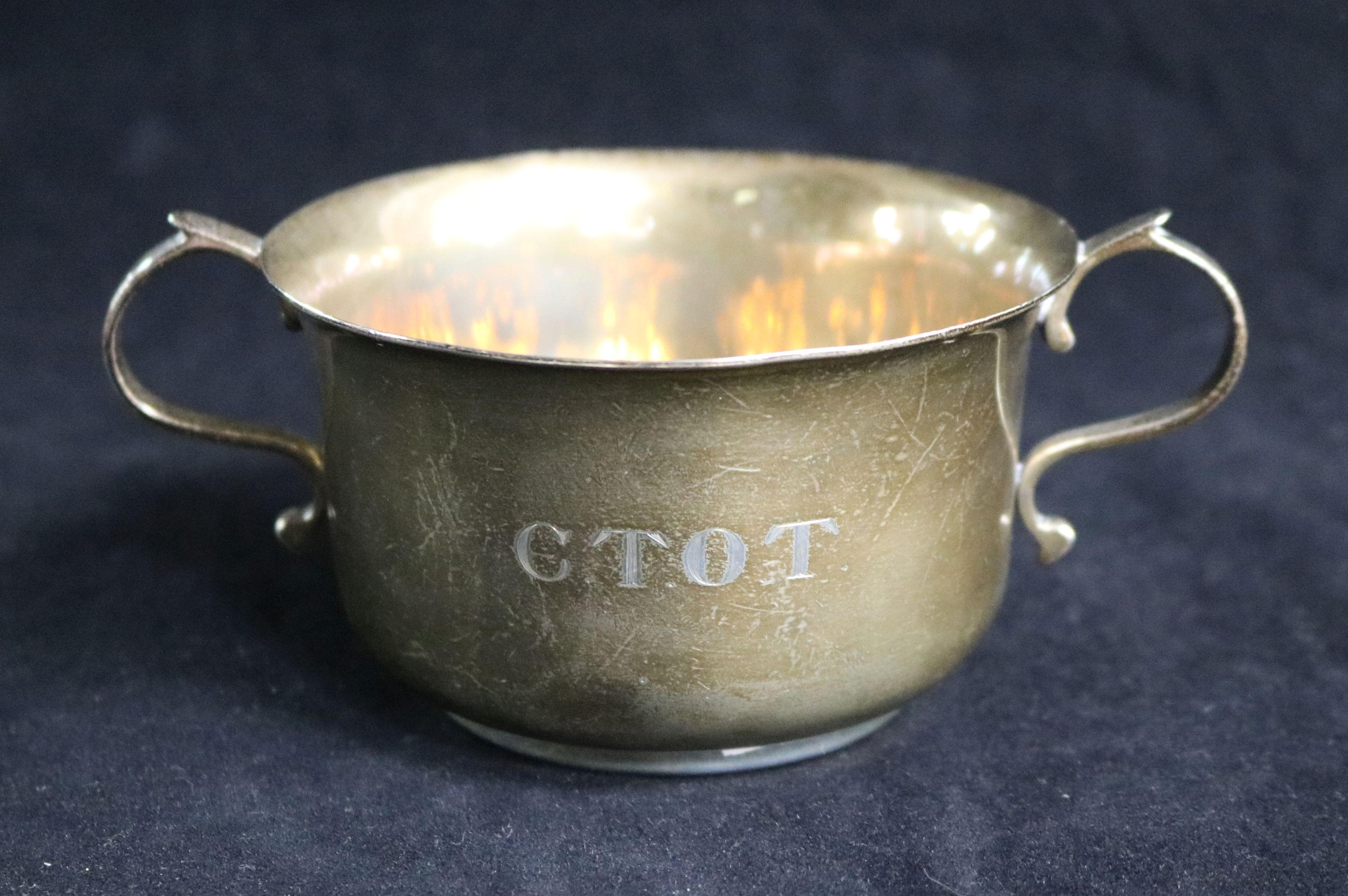 A 1920's silver two handled silver porringer engraved C.T.O.T., 160 grams.