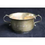 A 1920's silver two handled silver porringer engraved C.T.O.T., 160 grams.