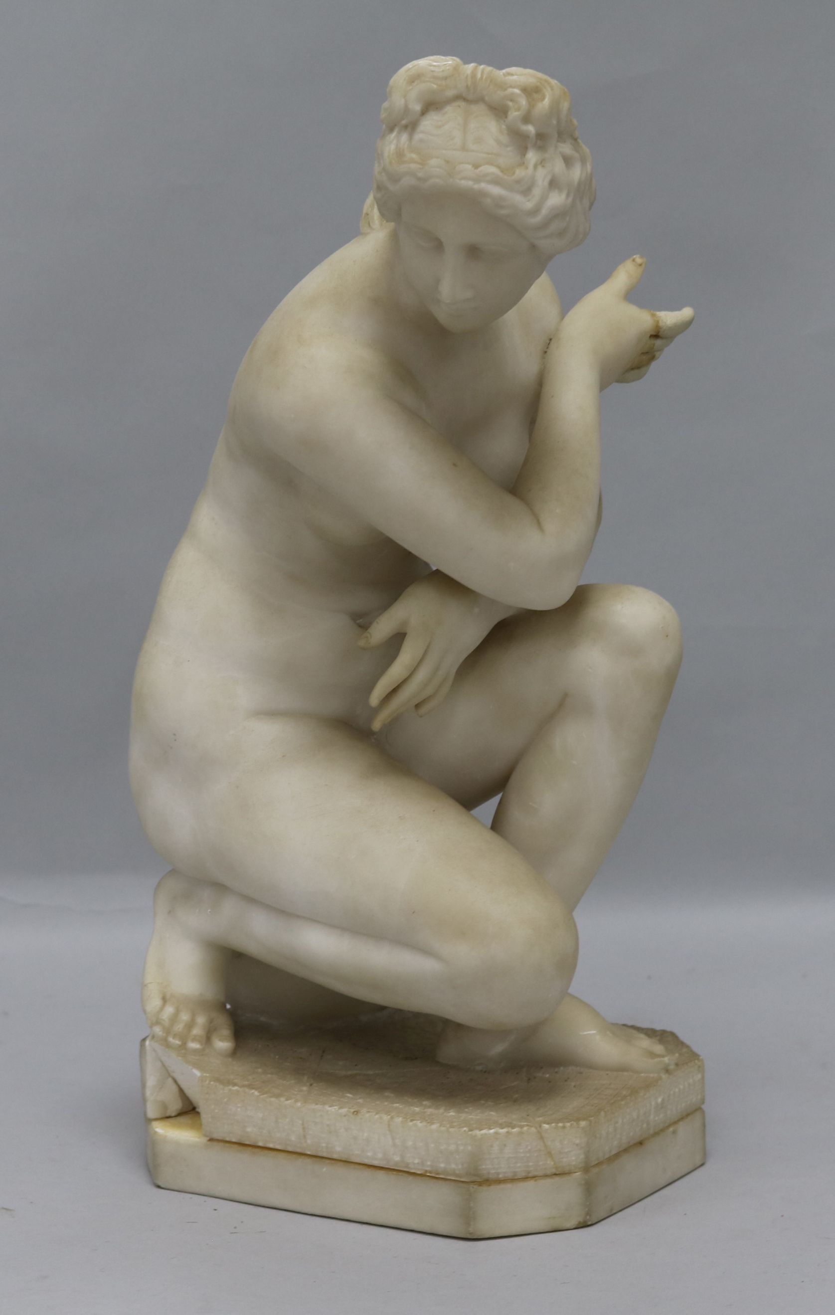 After the Antique, an alabaster figure of crouching Venus