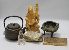 An Oriental iron teapot, koro, metal ware cases and a wood figure
