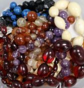 A collection of assorted bead necklaces including amethyst, ivory etc.
