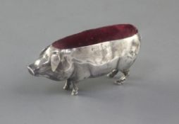 An Edwardian novelty silver pin cushion, modelled as a pig by Cohen & Charles, Birmingham, 1905,