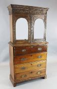 A 19th century Anglo-Indian padouk secretaire bookcase, the upper section carved throughout with