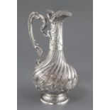 An early 20th century French silver mounted glass claret jug, possibly Baccarat, with wrythened