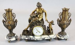 An early 20th century French bronzed spelter three piece clock garniture surmounted with figures