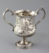 A Victorian silver two handled cup by Henry Holland, embossed with ducks and geese in a country