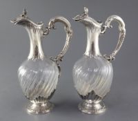 A pair of late 19th/early 20th century French 950 standard silver mounted glass rococco style claret