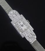 A 1930's Art Deco platinum and diamond manual wind cocktail watch, with rectangular Arabic dial