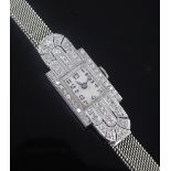 A 1930's Art Deco platinum and diamond manual wind cocktail watch, with rectangular Arabic dial