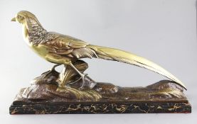R. Pollin. A French Art Deco patinated bronze model of a pheasant, signed, on naturalistic base with