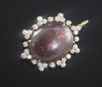 A Victorian style gold, black opal and diamond set pendant brooch, the oval opal measuring
