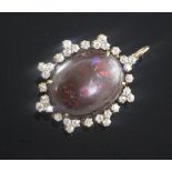 A Victorian style gold, black opal and diamond set pendant brooch, the oval opal measuring