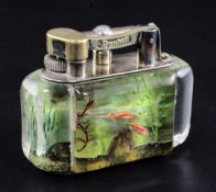 A Dunhill aquarium desk lighter, decorated with five fish in a tank, signed, width 3.75in. height