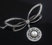 A Belle Epoque platinum and gold, diamond and split pearl set bow brooch with openwork target