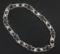 A Georg Jensen sterling silver and cabochon amethyst necklace, no. 57, set with sixteen amethysts,