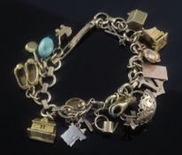 A 1940's 9ct gold charm bracelet, hung with seventeen mainly 9ct gold charms including Coronation