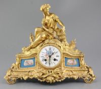 A Louis XV style gilt bronze 8 day mantel clock with Sevres style inset panels