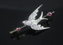 A Victorian style gold, ruby and rose cut diamond set swallow brooch, 45mm.