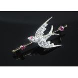 A Victorian style gold, ruby and rose cut diamond set swallow brooch, 45mm.