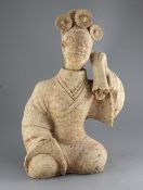 A large Chinese pottery figure of a seated entertainer, Eastern dynasty (25-220AD), with separate