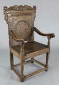 A 17th century oak Wainscot chair, with marquetry inlaid panelled back, W.2ft 2in. H.3ft 8in.