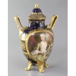 A Vienna style twin handled vase and cover, c.1910, painted with a portrait of an aristocratic