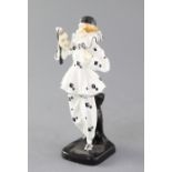 A rare Doulton & Co figure 'The Mask' HN733, c.1926, the pierette type figure wearing black and