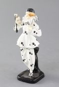 A rare Doulton & Co figure 'The Mask' HN733, c.1926, the pierette type figure wearing black and
