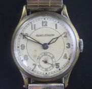 A gentleman's 1930's/1940's steel and gilt Jaeger Le Coultre manual wind wrist watch, with Arabic