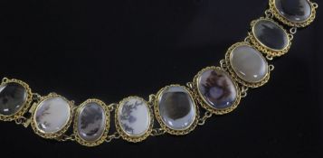 A 19th century gold and moss agate bracelet, set with nine oval stones, (a.f.), 6.75in.
