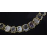 A 19th century gold and moss agate bracelet, set with nine oval stones, (a.f.), 6.75in.