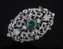 A 19th century gold and silver, emerald and old and rose cut diamond set pierced oval brooch, with