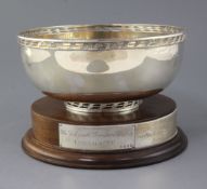 A modern silver presentation rose bowl by A.E. Jones Ltd, with pierced border, on wooden plinth base