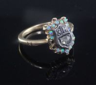 An Edwardian 18ct gold, white opal and rose cut diamond set shield shaped ring, missing two opals,