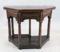 A 17th century oak credence table, with later folding top and central drawer, canon barrel legs