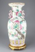 A large Chinese 'nine peach' famille rose vase, 19th century, of baluster form, lappeted lower