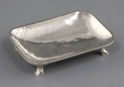 A 1930's Omar Ramsden small silver rounded rectangular dish, on angular feet, London, 1939, 10cm, 64