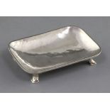 A 1930's Omar Ramsden small silver rounded rectangular dish, on angular feet, London, 1939, 10cm, 64