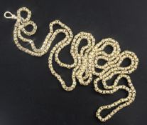 An early 20th century American? 10ct gold oval and box link guard chain, 148cm, 58.4 grams.