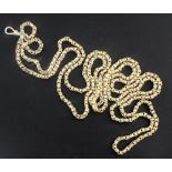 An early 20th century American? 10ct gold oval and box link guard chain, 148cm, 58.4 grams.