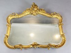 A French giltwood and gesso cartouche shaped wall mirror, with scroll crest, W.3ft 9in. H.3ft