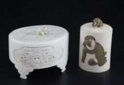 Two Japanese ivory jars and covers, early 20th century, the first carved in relief with animals,