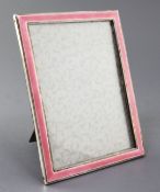 An early 1930's silver and pink guilloche enamel mounted rectangular photograph frame by S.W.