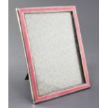 An early 1930's silver and pink guilloche enamel mounted rectangular photograph frame by S.W.