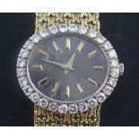 A lady's 18ct gold Piaget manual wind dress wrist watch with diamond set bezel, the oval dial with