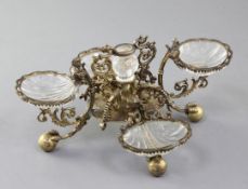 A late 18th/early 19th century German? silver gilt table condiment stand, with scrolling supports