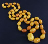 A single strand graduated oval amber bead necklace, gross weight 136 grams, 108cm.