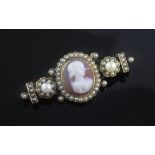 A Victorian gold, hardstone cameo and seed pearl brooch, the central oval cameo carved with the bust